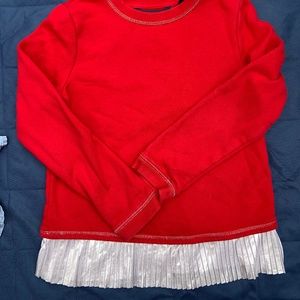 Red sweatshirt with silver ruffle trim